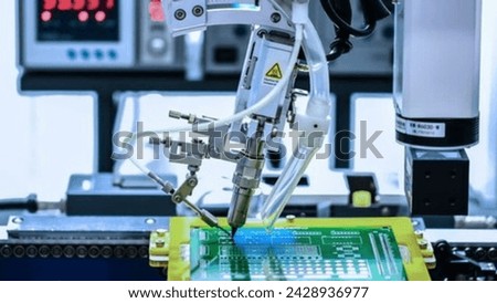 Solar Panel Assembly and Industrial Robot Arm at Bright, Modern Factory Production Line
