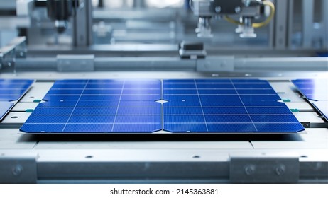 Solar Panel Cells are  Being Moved and Tested on Conveyor during Solar Panel Production Process on Advanced Factory