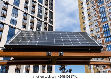 A solar panel in a cityscape utilizes renewable energy to sustainably power the urban area under a clear sky. Keywords cityscape, photovoltaic, sustainability, sustainable, urban