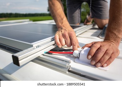 Solar panel connection cables on top of a camper van - Shutterstock ID 1889505541