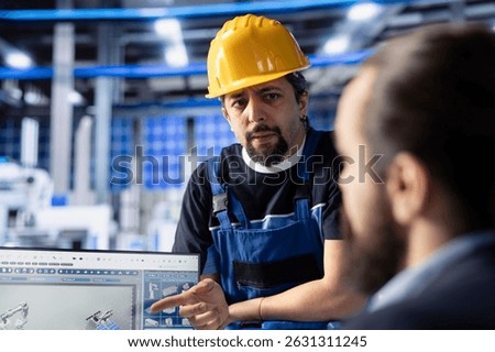 Solar panel facility engineering team reviewing photovoltaic system performance. Teamworking colleagues analyzing production metrics in industrial plant office to optimize efficiency
