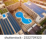 solar panel farming on roof of hotel, resort, house or residential building