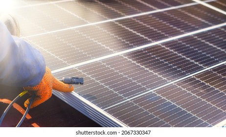 Solar panel installation on the roof. Installing cables of  Solar Cell on a Roof . European Union, Solar energy, renewable energy, Fossil fuels, solar power - Shutterstock ID 2067330347
