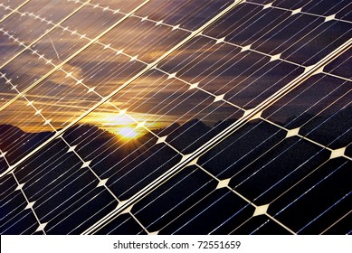 Solar Panel With Mountains And Setting Sun, Green Economy