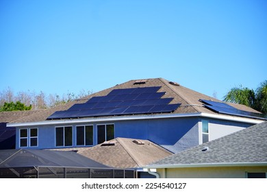 Solar panel on a house roof; Green energy from sun	 - Shutterstock ID 2254540127