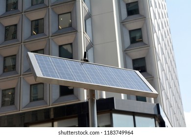 Solar Panel On Pole In Front of Building