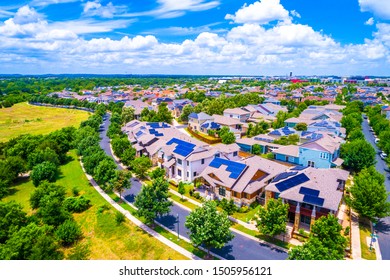 Solar panel rooftops covering a sustainable community in east Austin Texas 2019 aerial drone view of suburb with renewable energy and solar energy colorful bright future living