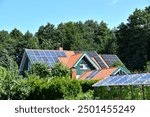 Solar Panel station on country House Roof. Solar panels on tiled roof 