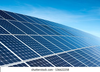 Solar Panels Against The Deep Blue Sky - Shutterstock ID 136622258