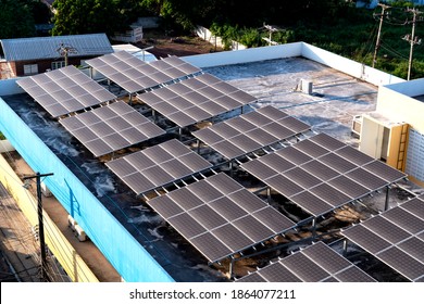 Solar panels or Solar cells on building rooftop or terrace with sun light, Can saving energy. Sun or renewable or Clean energy. - Shutterstock ID 1864077211