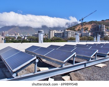 Solar Panels Or Solar Cells On Rooftop Or Terrace Of Building In Cape Town, South Africa. Can Saving Energy. Green Or Sun Or Renewable Or Clean Energy.