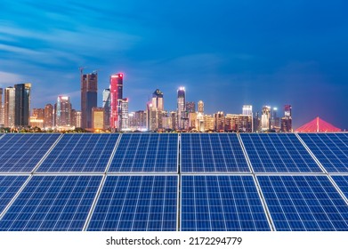 Solar Panels And Cityscape At Sunset, Shanghai China