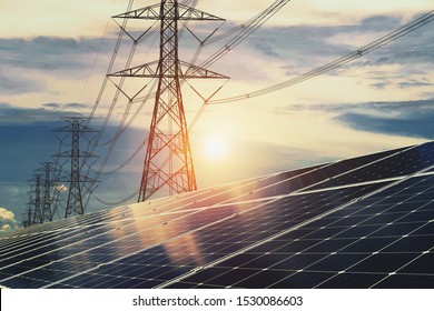 Solar panels with electricity pylon and sunset. Clean energy concept. power alternative