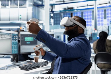 Solar panels factory engineer using VR headset to improve solar energy automation, eco friendly. Photovoltaics manufacturing plant specialist using virtual reality equipment, high tech.