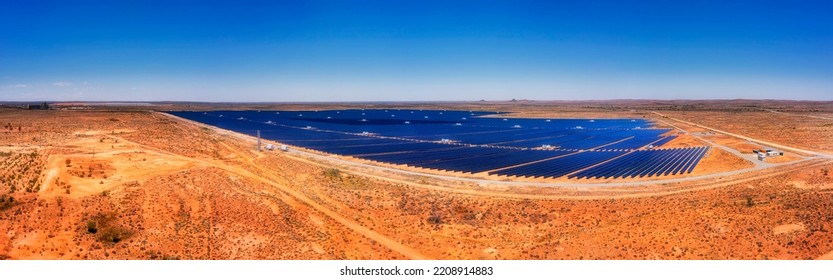 Solar Panels Farm Generation Of Electricity Energy In Red Outback Desert Near Broken Hill City Of Australia - Aerial Panorama.