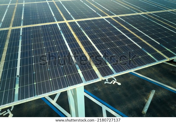 Solar panels installed over\
parking lot for parked cars for effective generation of clean\
energy