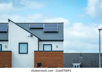 Solar Panels Mounted On The Roof Of A Modern New-build House In England UK