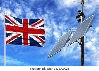 Solar Panels On A Background Of Blue Sky With A Flagpole And The Flag Of United Kingdom