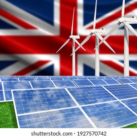 Solar Panels On The Background With The Flag Of United Kingdom And Wind Turbine