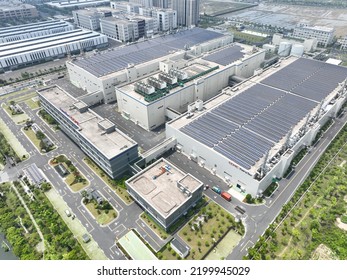 solar panels on factory rooftop - Shutterstock ID 2199945029