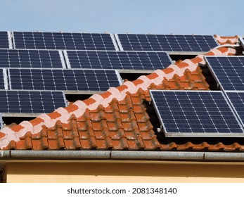solar panels on house  roof, forest for background , electricity ecology renewable energy generator - Shutterstock ID 2081348140