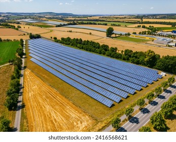 Solar panels on a solar park in the countryside for the production of renewable energy in the German Energiewende - Powered by Shutterstock