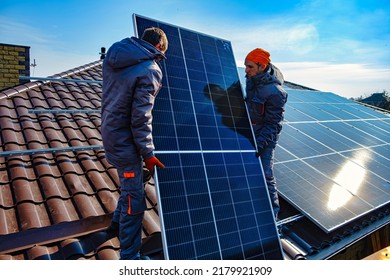 Solar panels on roof.  Installing a Solar Cell on a Roof. Workers installing solar cell farm power plant eco technology. - Shutterstock ID 2179921909
