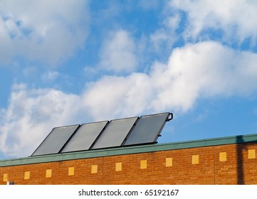 Solar Panels On Roof Of Small Commercial Building