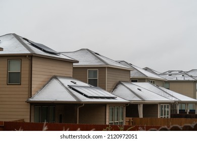 Solar Panels on Rooftop covered in Snow and Ice during Winter Storm 2022 in Austin Texas USA