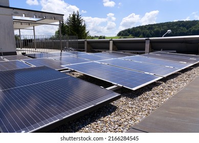 Solar panels on rooftop at village Forch, Canton Zürich, on a sunny summer day. Photo taken June 10th, 2022, Forch, Switzerland.
