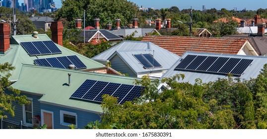 Solar Panels On Suburban House Roofs In Melbourne, Australia