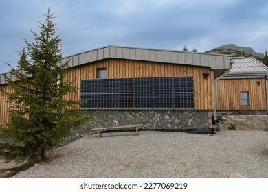 Solar panels on wall on chalet under mountain Chleb, national park Mala Fatra, Slovakia - Shutterstock ID 2277069219