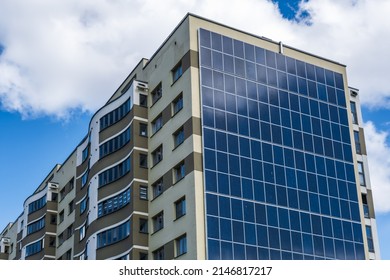 solar panels on the wall of a multi-storey building. Renewable solar energy.
