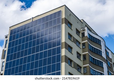 solar panels on the wall of a multi-storey building. Renewable solar energy.