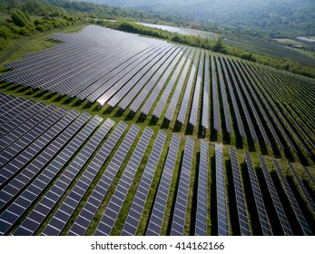 Solar panels producing green, environmentally friendly energy from the sun - Shutterstock ID 414162166