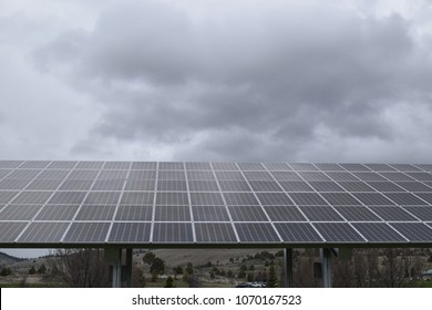 Solar Panels With Storm Clouds