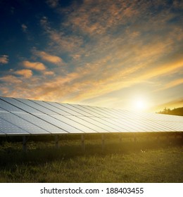 Solar Panels Under Blue Sky On Sunset