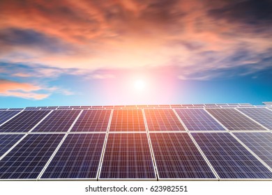 Solar Panels Under Blue Sky On Sunset