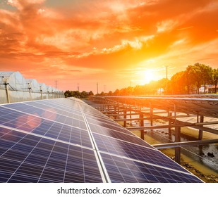 Solar Panels Under Blue Sky On Sunset