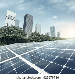 Solar panels and urban construction background - Shutterstock ID 628578716