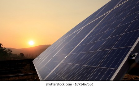Solar panels and warm sunrise