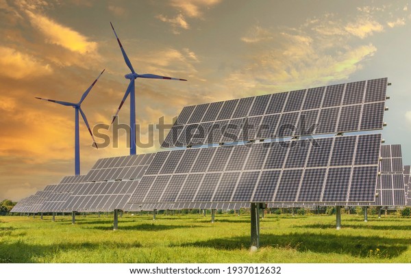 Solar panels wind turbines installed as renewable\
energy sources for electricity and power supply. Innovation and\
technology, environmental friendly energy. Solar farm under sunny\
day