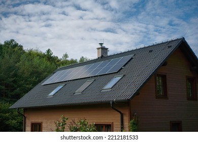 Solar photovoltaic panels on roof of family house, alternative energy, saving resources and sustainable lifestyle concept. - Shutterstock ID 2212181533