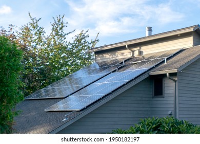 Solar photovoltaic panels on a slanted roof in the Pacific Northwest.