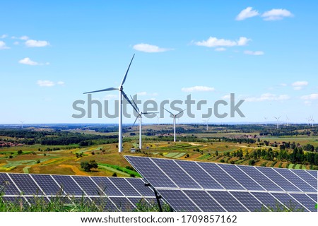 Solar photovoltaic panels and wind turbines. Energy concept