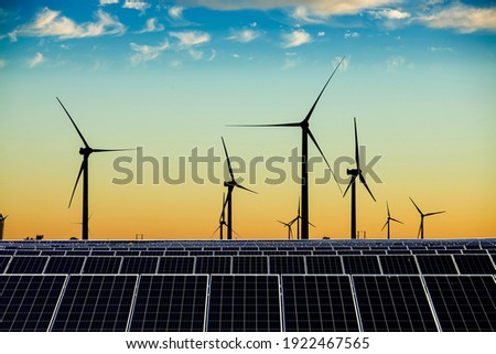 Solar photovoltaic panels and wind turbines. Energy concept