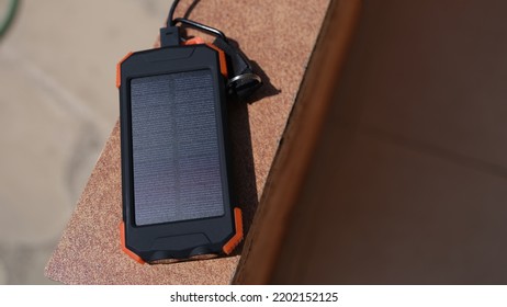 Solar Power Bank Recharging By Sunlight Outdoor Closeup