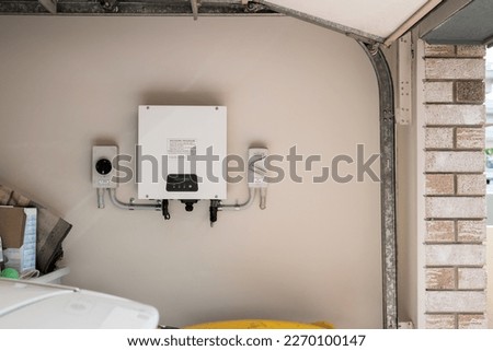 Solar power inverter mounted inside garage of a house, domestic system