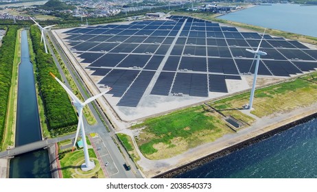 Solar power plant and Windmills aerial view. Renewable energy. Green tech. - Shutterstock ID 2038540373