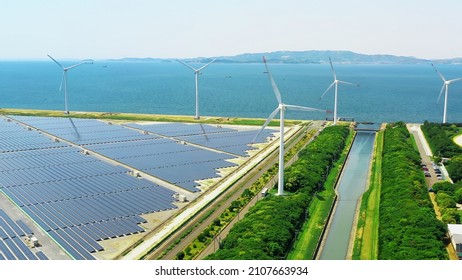 Solar Power Plant And Windmills Aerial View. Renewable Energy. Green Tech.